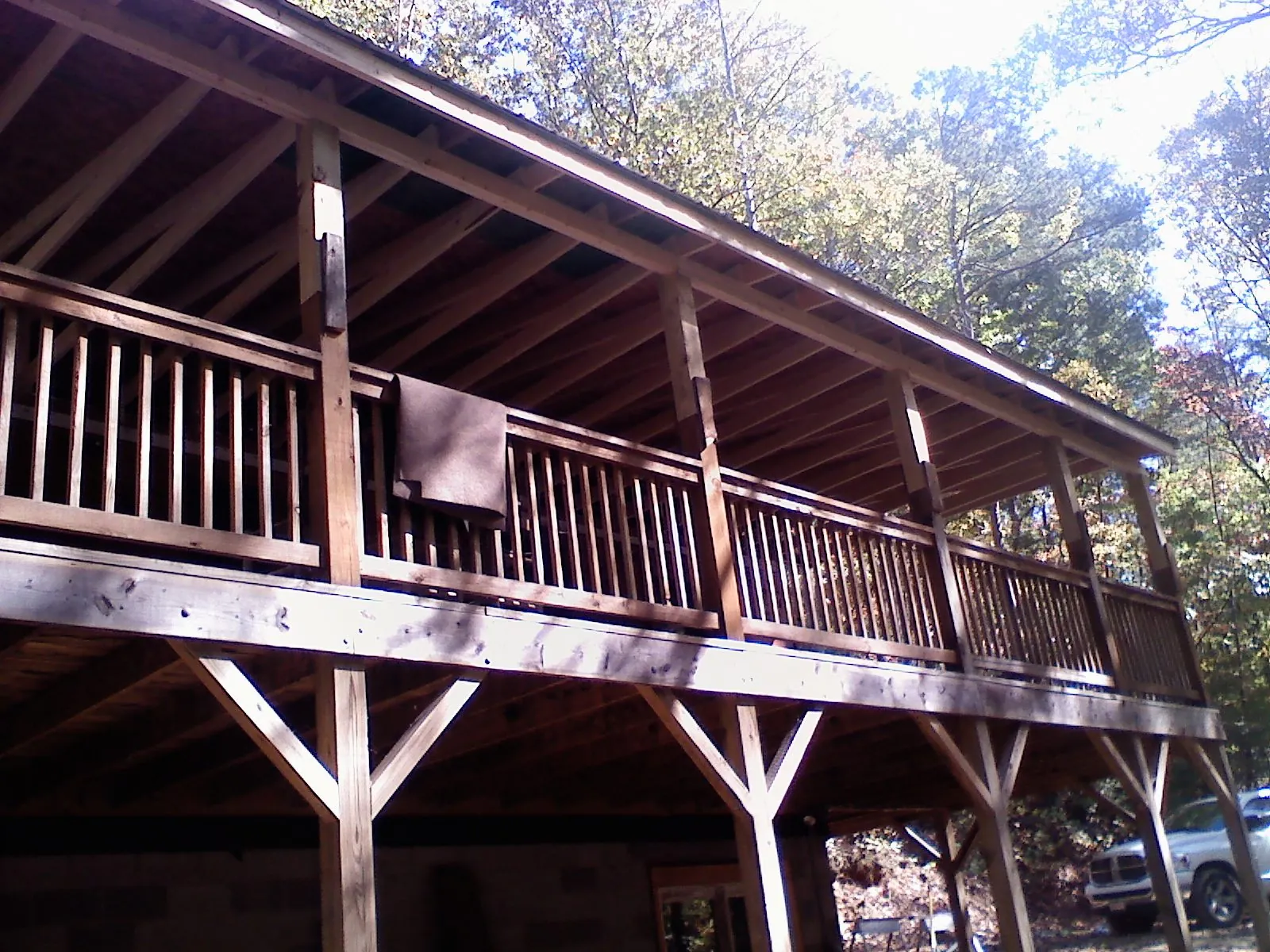 Timber framing under a new elevated porch and deck — Roof Leak Repair in State Center by Roofing Brothers